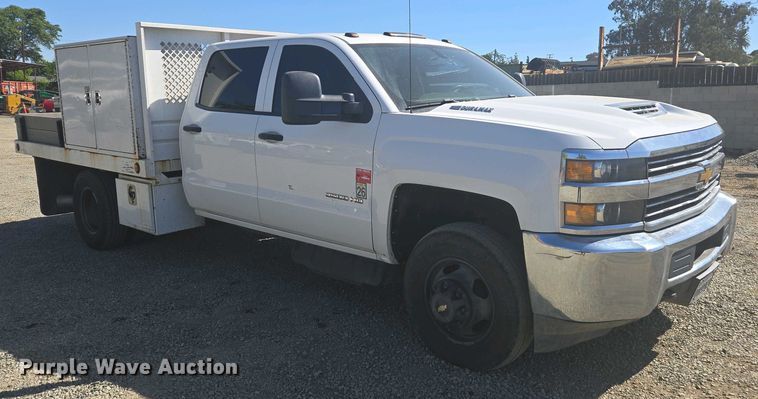 image for item EC0952 2018 Chevrolet Silverado 3500HD Crew Cab flatbed pickup truck