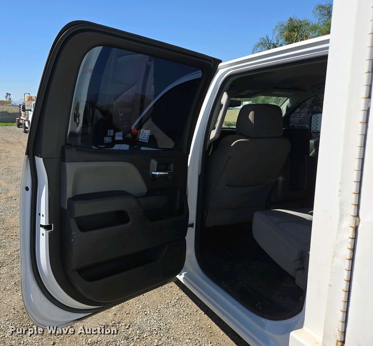 image for item EC0952 2018 Chevrolet Silverado 3500HD Crew Cab flatbed pickup truck