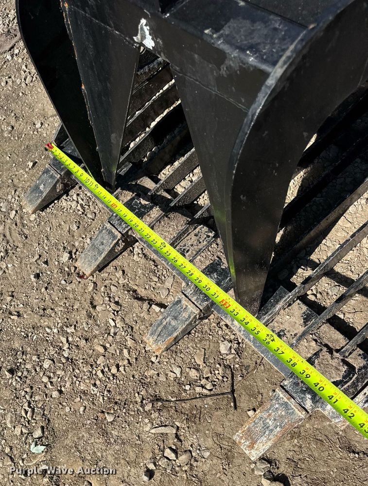 image for item EN4584 Titan Compact utility loader rock grapple bucket