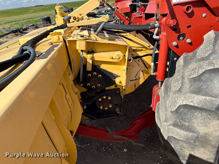 image for item DK6959 2009 New Holland H8080 swather / windrower