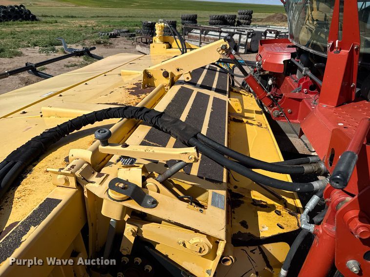 image for item DK6959 2009 New Holland H8080 swather / windrower