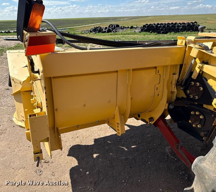 image for item DK6959 2009 New Holland H8080 swather / windrower