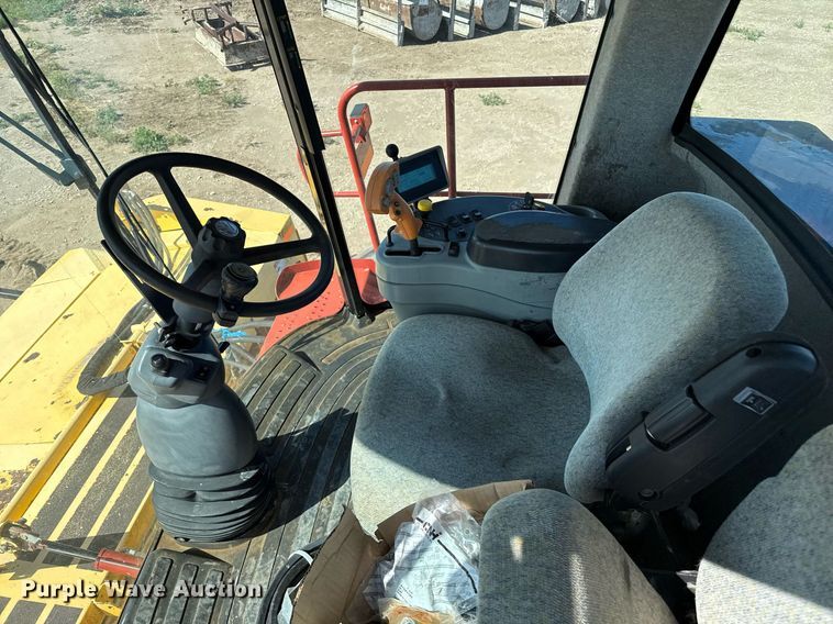 image for item DK6959 2009 New Holland H8080 swather / windrower