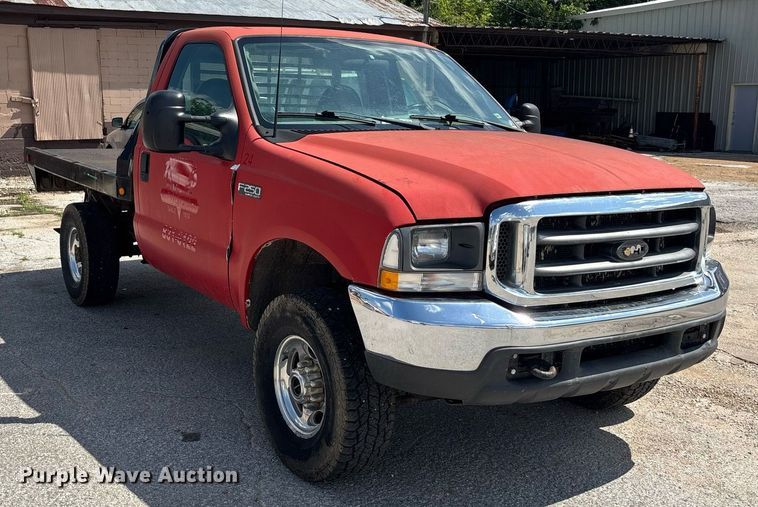 image for item DY0360 2003 Ford F250 flatbed pickup truck