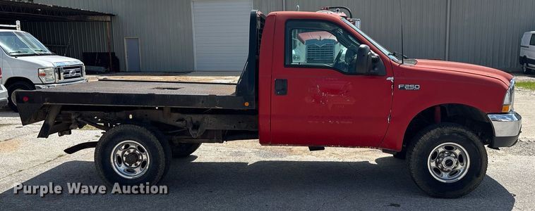image for item DY0360 2003 Ford F250 flatbed pickup truck
