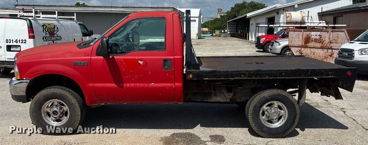 image for item DY0360 2003 Ford F250 flatbed pickup truck