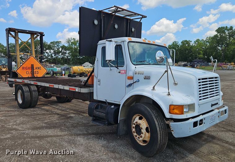 image for item EB8170 1999 International 4700 flatbed truck with crash attenuator