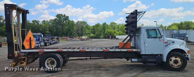 image for item EB8170 1999 International 4700 flatbed truck with crash attenuator