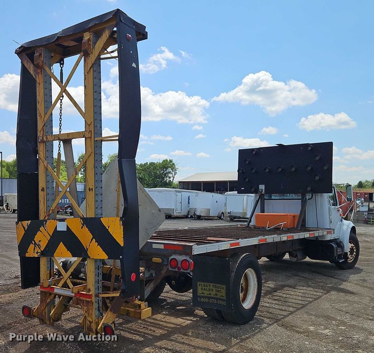 image for item EB8170 1999 International 4700 flatbed truck with crash attenuator