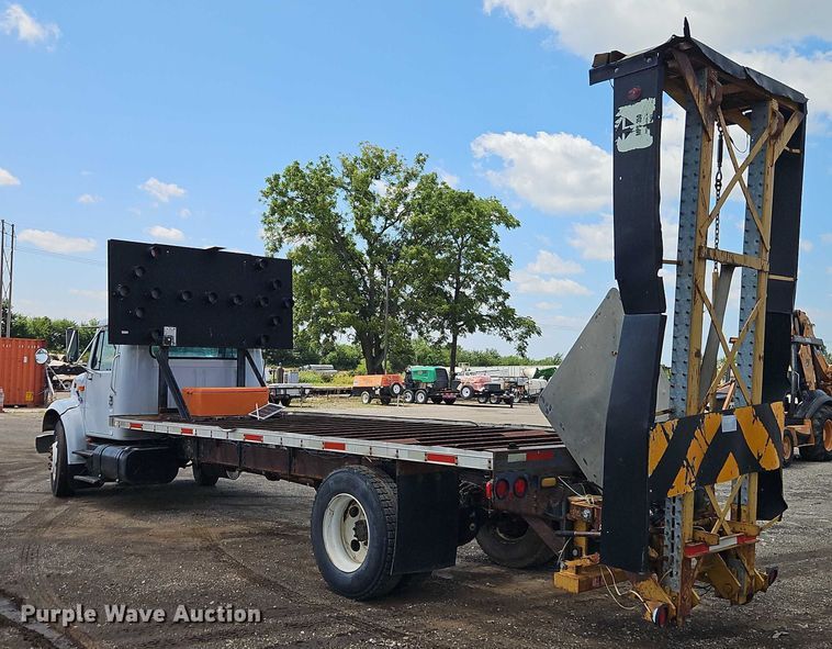 image for item EB8170 1999 International 4700 flatbed truck with crash attenuator