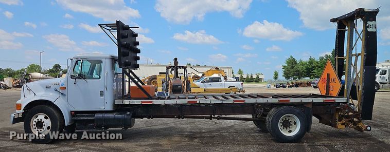 image for item EB8170 1999 International 4700 flatbed truck with crash attenuator