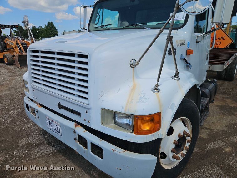 image for item EB8170 1999 International 4700 flatbed truck with crash attenuator