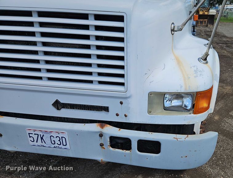 image for item EB8170 1999 International 4700 flatbed truck with crash attenuator