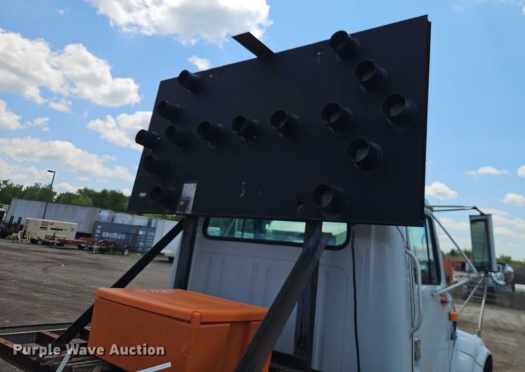 image for item EB8170 1999 International 4700 flatbed truck with crash attenuator