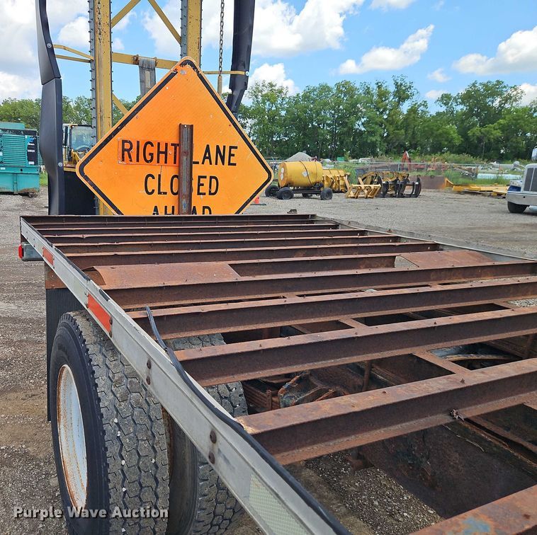 image for item EB8170 1999 International 4700 flatbed truck with crash attenuator