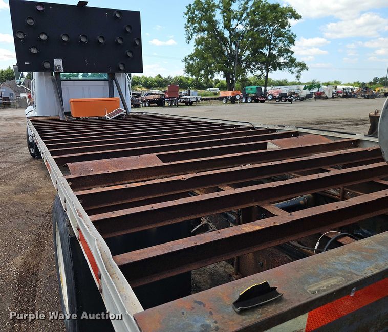 image for item EB8170 1999 International 4700 flatbed truck with crash attenuator