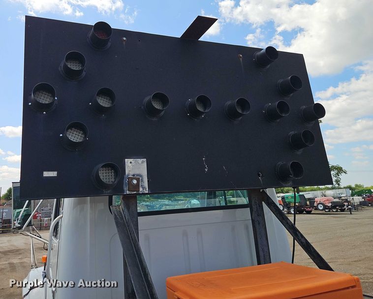 image for item EB8170 1999 International 4700 flatbed truck with crash attenuator