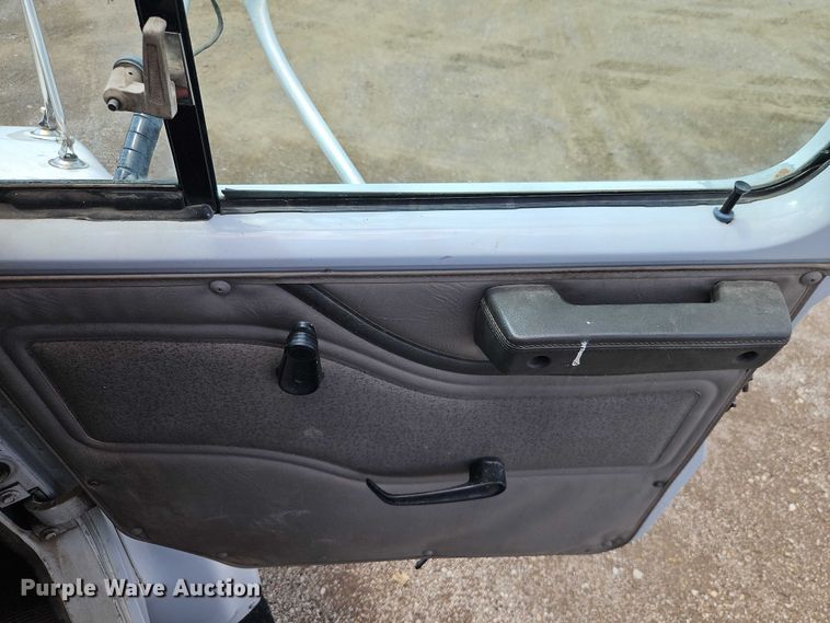 image for item EB8170 1999 International 4700 flatbed truck with crash attenuator