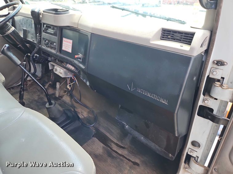 image for item EB8170 1999 International 4700 flatbed truck with crash attenuator