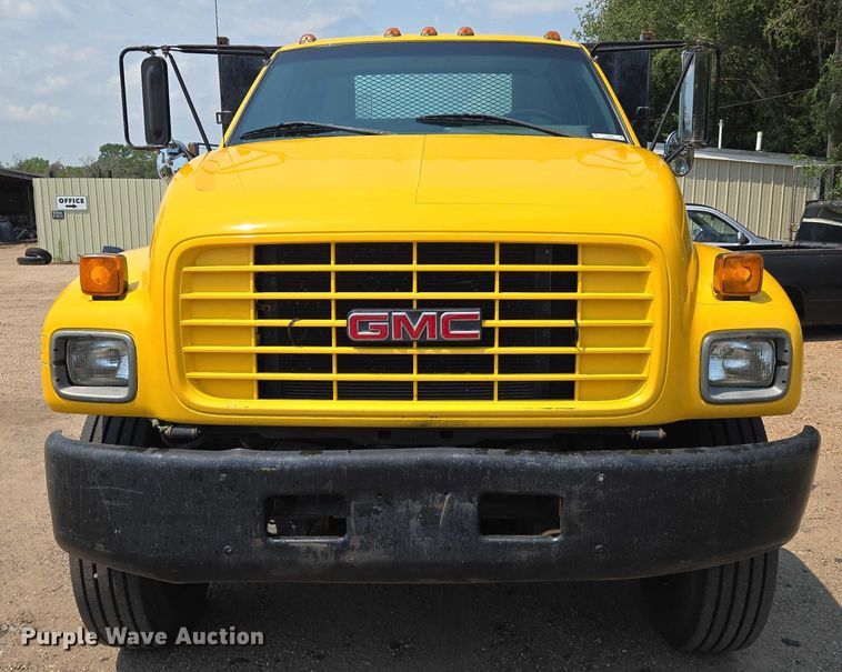 image for item EN8344 1999 GMC C7 flatbed truck