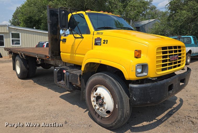 image for item EN8344 1999 GMC C7 flatbed truck