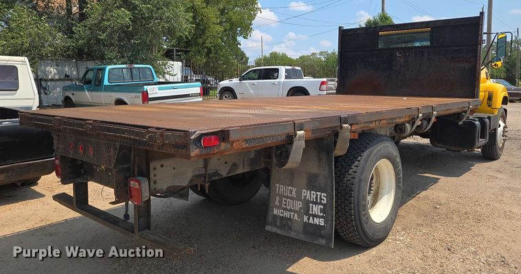 image for item EN8344 1999 GMC C7 flatbed truck