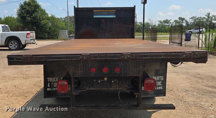 image for item EN8344 1999 GMC C7 flatbed truck