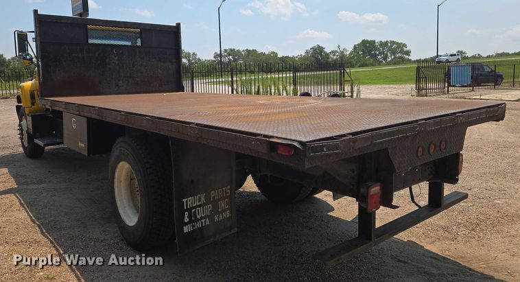 image for item EN8344 1999 GMC C7 flatbed truck