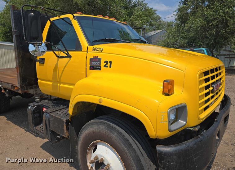 image for item EN8344 1999 GMC C7 flatbed truck