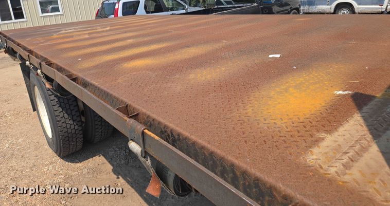 image for item EN8344 1999 GMC C7 flatbed truck