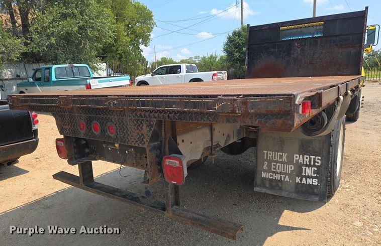 image for item EN8344 1999 GMC C7 flatbed truck