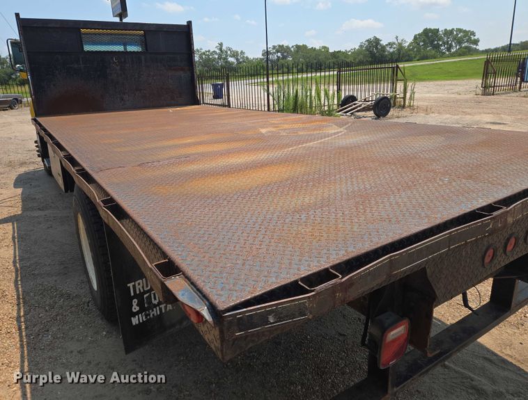 image for item EN8344 1999 GMC C7 flatbed truck