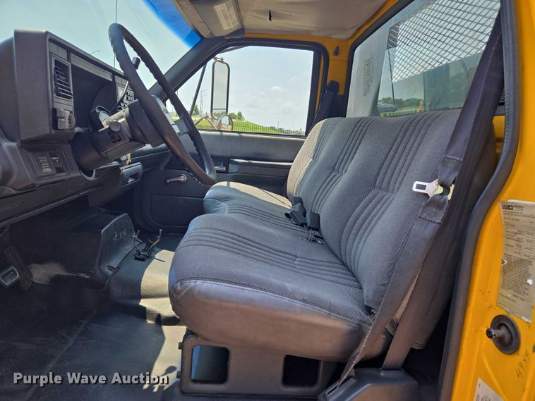 image for item EN8344 1999 GMC C7 flatbed truck