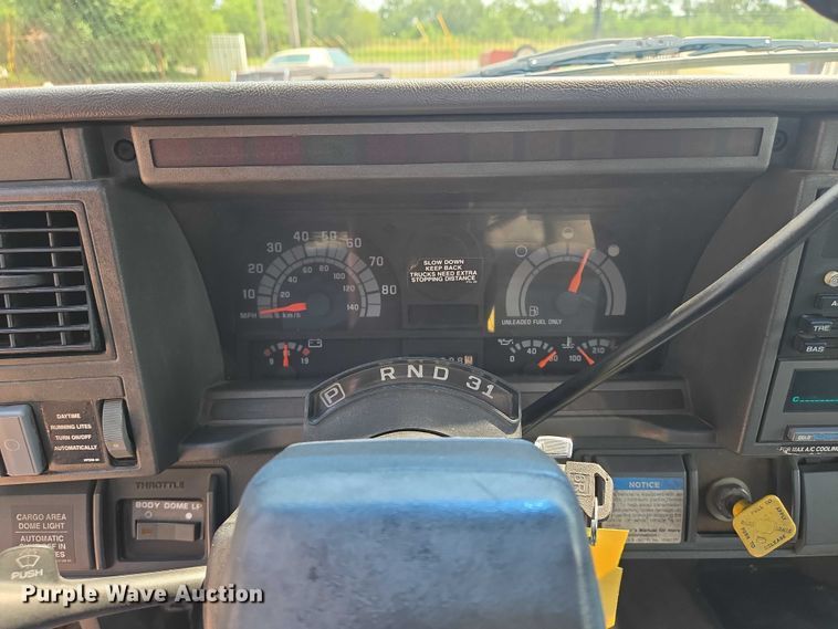 image for item EN8344 1999 GMC C7 flatbed truck