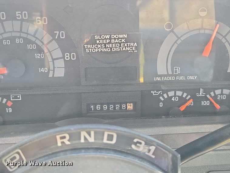 image for item EN8344 1999 GMC C7 flatbed truck