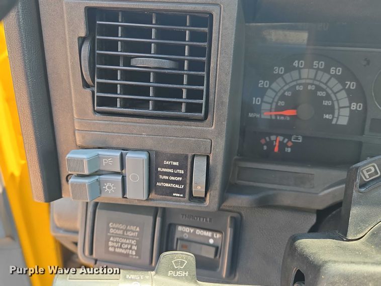 image for item EN8344 1999 GMC C7 flatbed truck