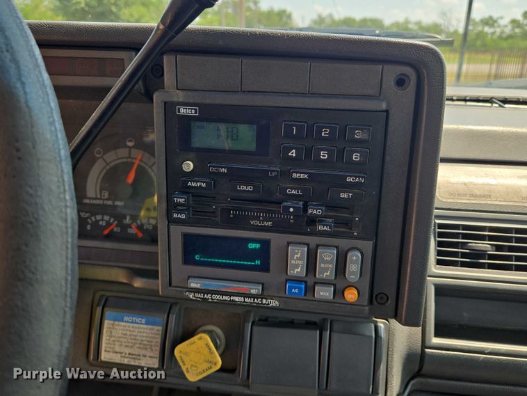 image for item EN8344 1999 GMC C7 flatbed truck