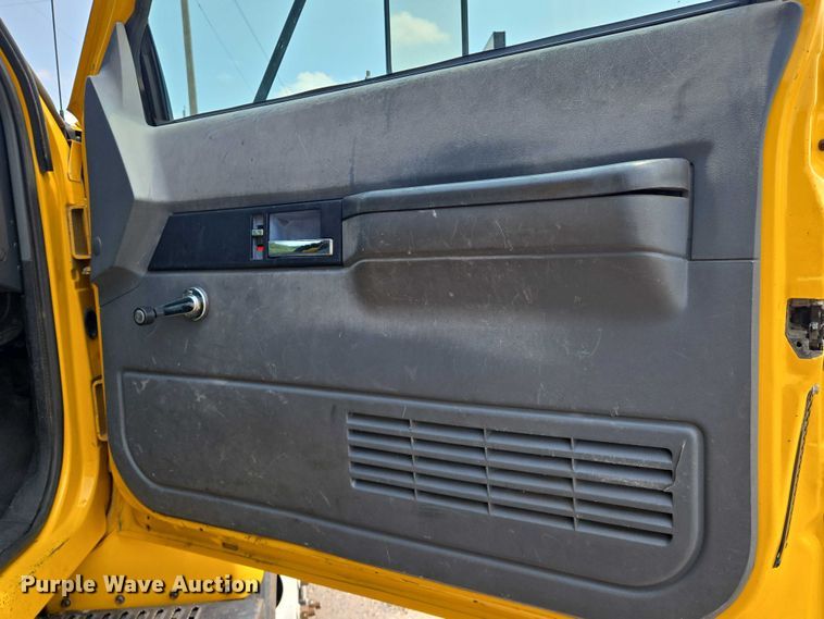 image for item EN8344 1999 GMC C7 flatbed truck