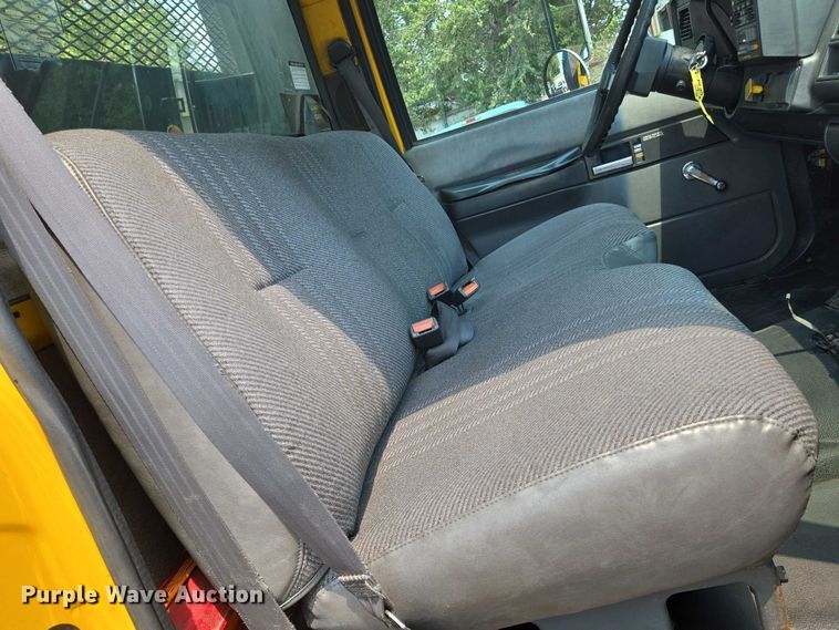 image for item EN8344 1999 GMC C7 flatbed truck