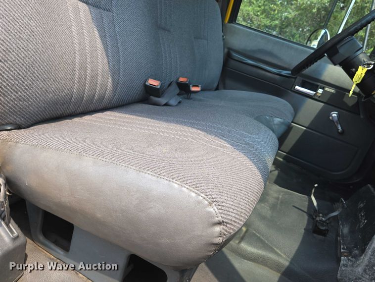 image for item EN8344 1999 GMC C7 flatbed truck