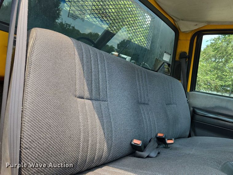 image for item EN8344 1999 GMC C7 flatbed truck