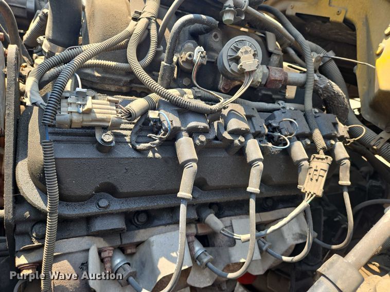 image for item EN8344 1999 GMC C7 flatbed truck