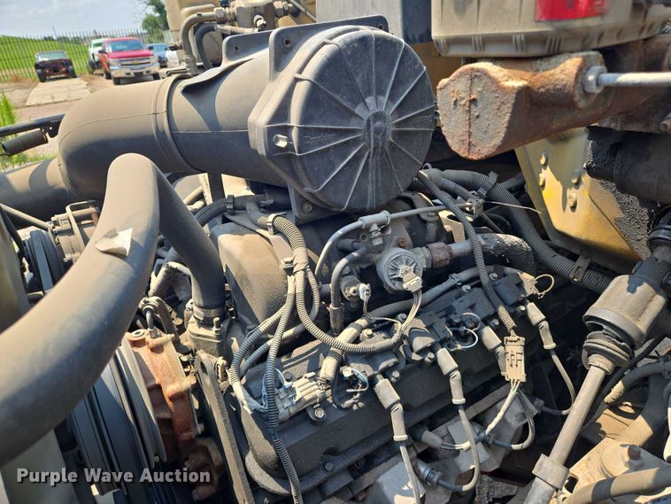 image for item EN8344 1999 GMC C7 flatbed truck