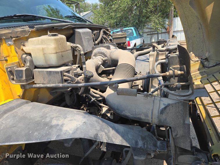 image for item EN8344 1999 GMC C7 flatbed truck