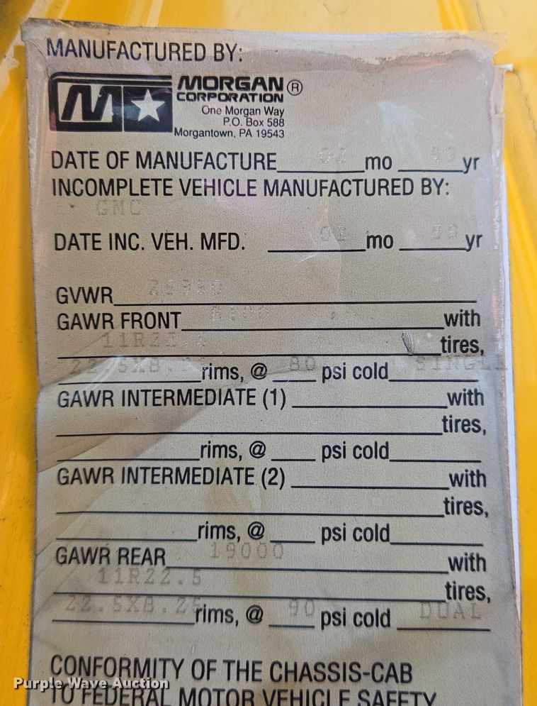 image for item EN8344 1999 GMC C7 flatbed truck