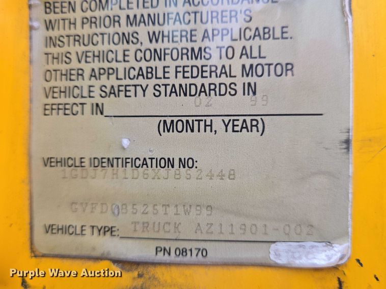 image for item EN8344 1999 GMC C7 flatbed truck