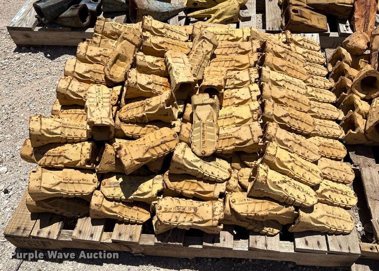 image for item DX8076 (7) pallets of bucket teeth 