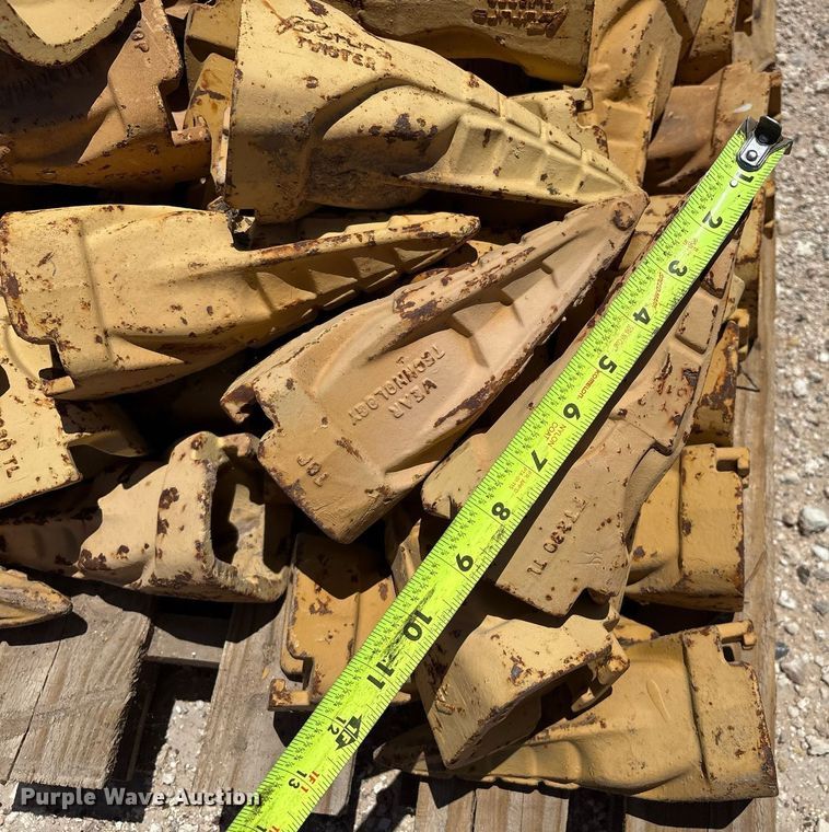 image for item DX8076 (7) pallets of bucket teeth 