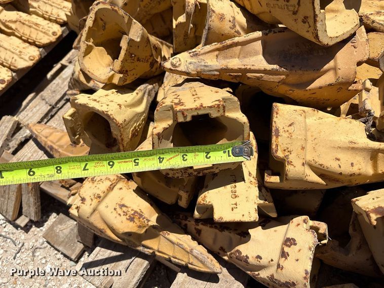 image for item DX8076 (7) pallets of bucket teeth 