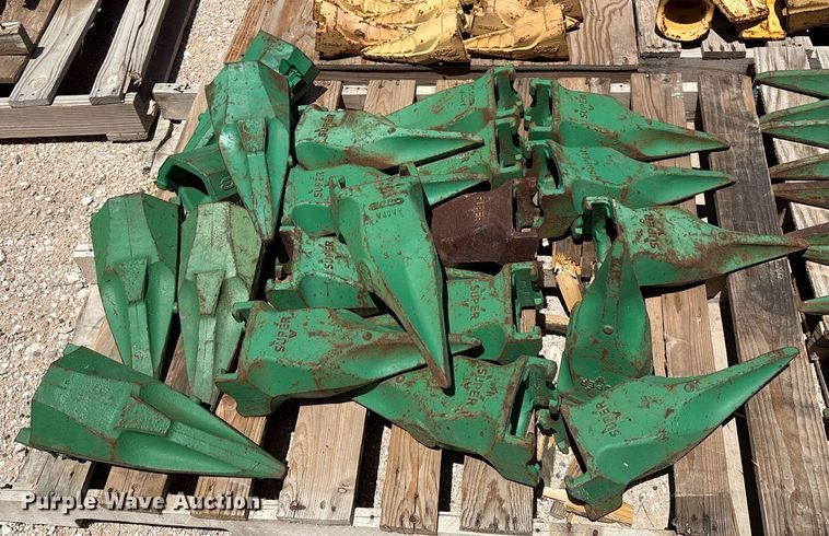 image for item DX8076 (7) pallets of bucket teeth 